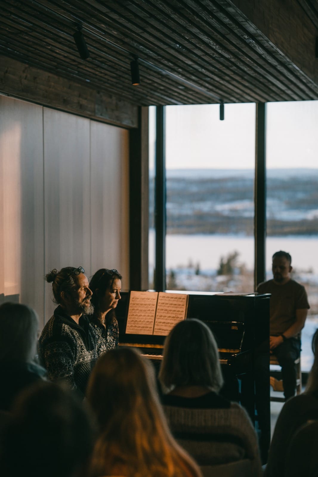 Musicians performing meditation in a serene setting.