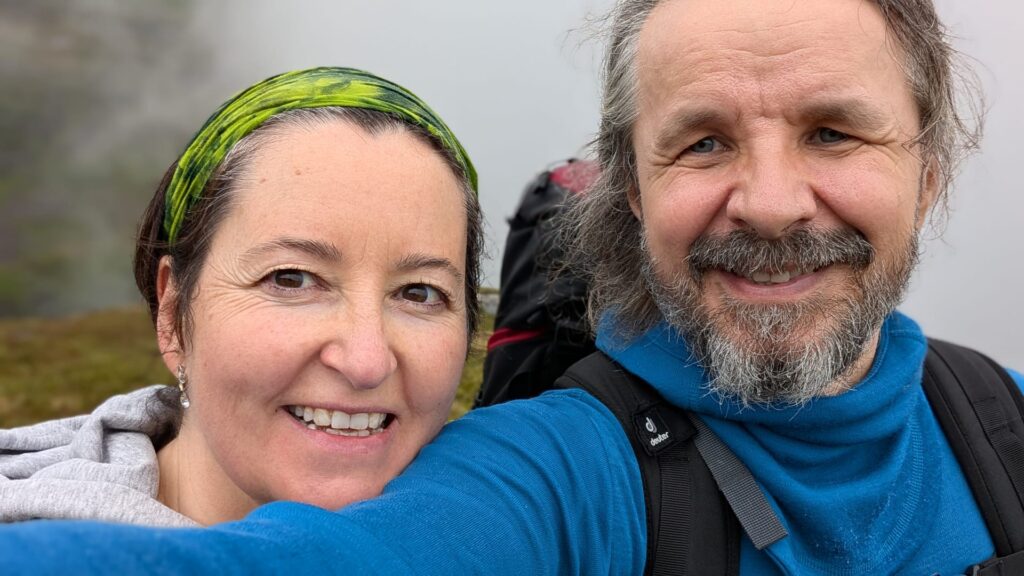 Annabel Guaita and Piotr Marcinów smiling outdoors